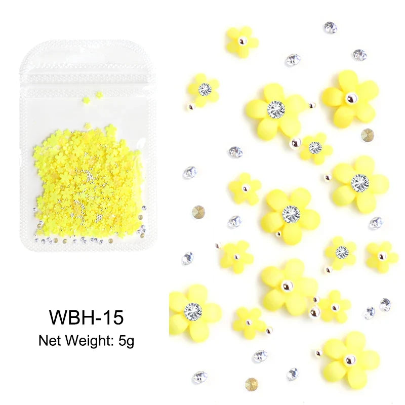 White acrylic flower nail art decorations with red and blue rhinestones for DIY manicure, from Blushimmer, in 5g package.
