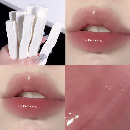 Blushimmer mirror lip gloss in a transparent tube, featuring a nude shade with floral design, long-lasting moisturizing liquid lipstick