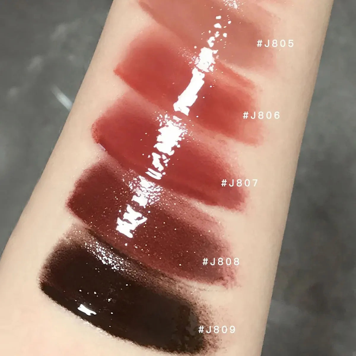 Girlcult Unreal Lip Gloss by Blushimmer with high-shine, water gloss finish, plumping effect, non-sticky, perfect for a luminous look.