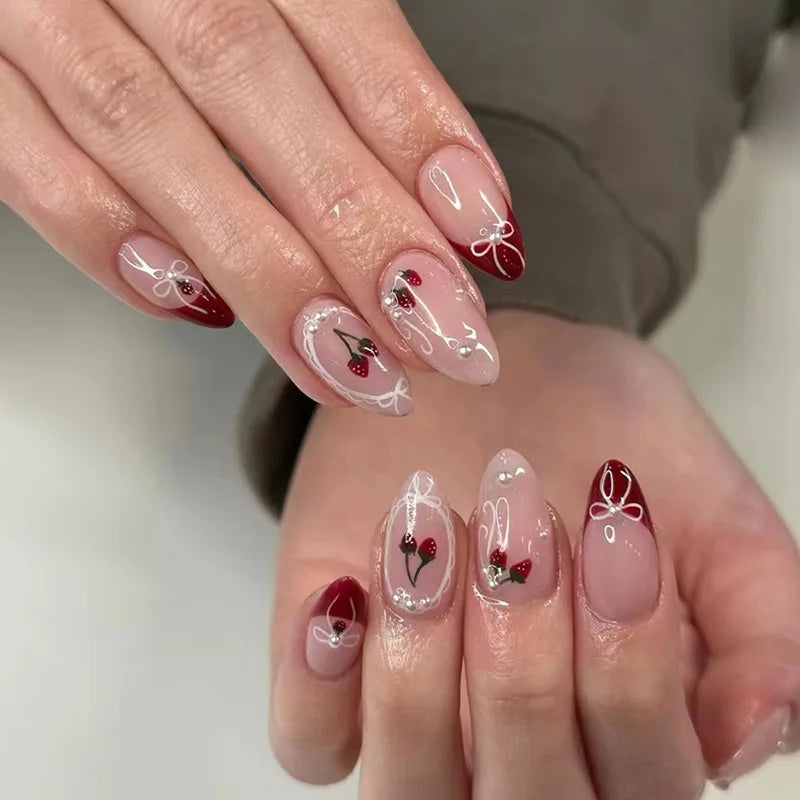 Set of 24 wine red almond press-on nails by Blushimmer featuring cartoon rabbit, bowknot, plaid, pearl details, and French style.