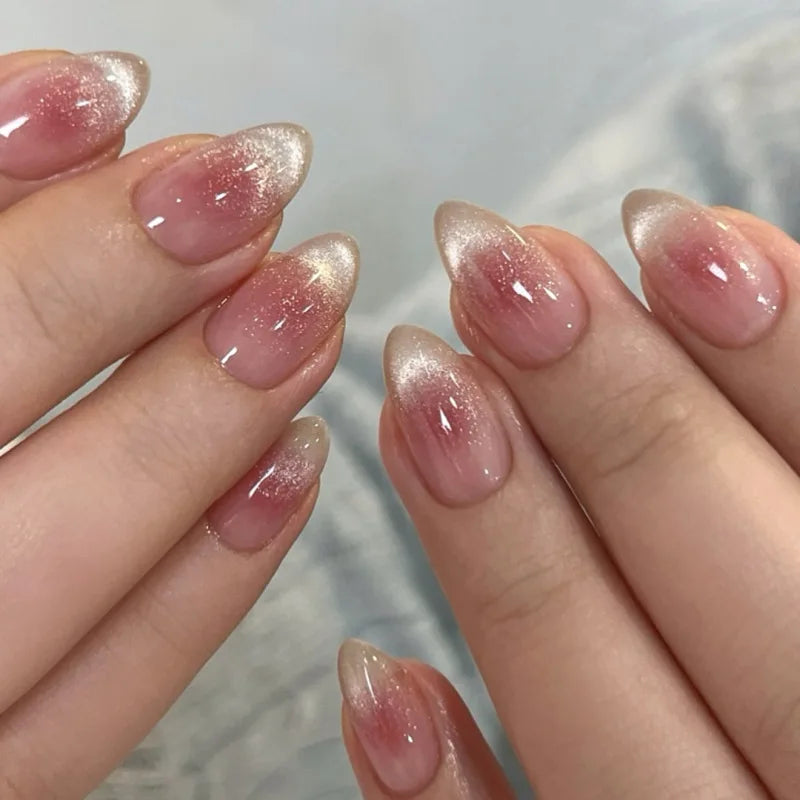 Set of 24 glossy red cat's eye press on nails by Blushimmer, almond-shaped false nails with nude color and decorative charms.