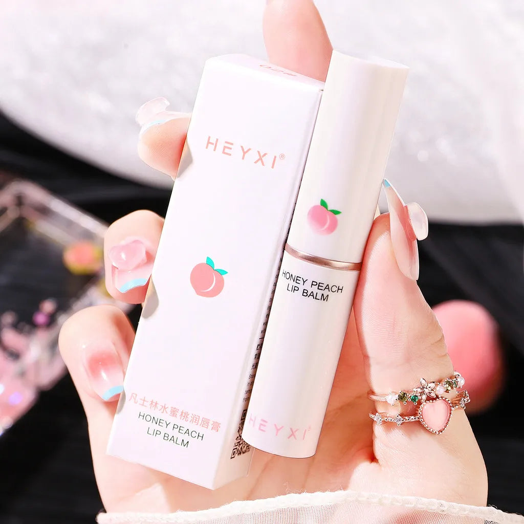 Blushimmer Honey Peach Lip Balm with color-changing, moisturizing, and nourishing lipstick for hydrated, plump lips.
