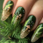 Set of 24 glossy almond false nails by Blushimmer with dark green forest mushroom pattern, gold sequins, and French style design.