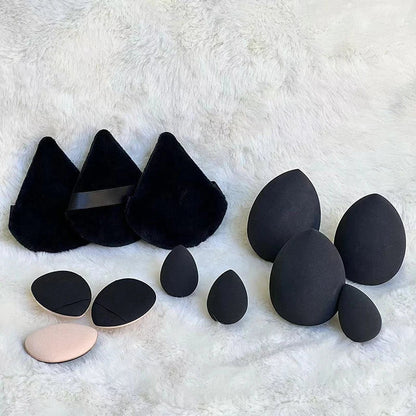 Set of 12 Blushimmer powder puffs with soft velour texture, triangle shape, ideal for loose and setting powder application.