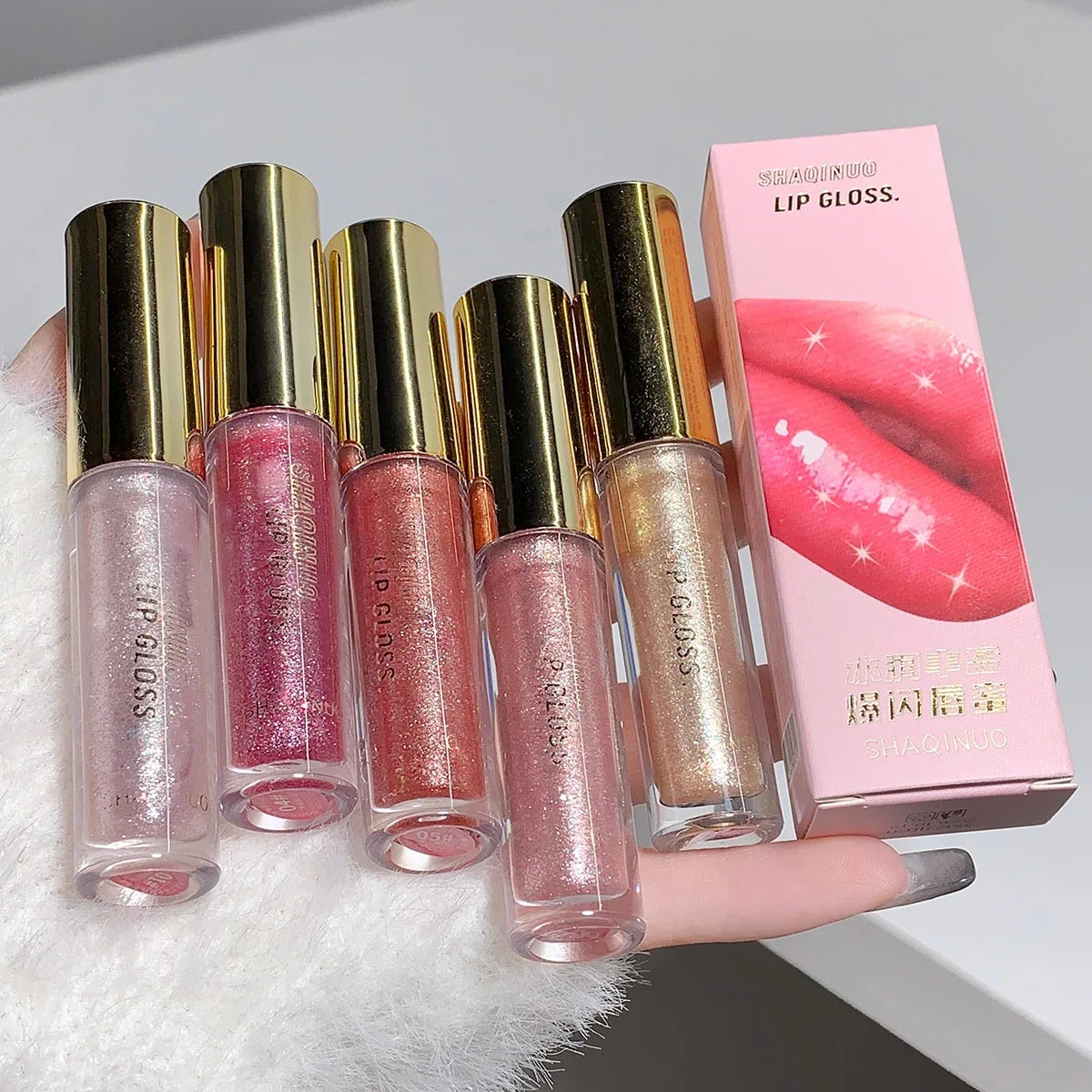 Blushimmer water-glossy lip gloss with sparkling finish, moisturizing lip oil for a plump, shiny, and hydrated pout.