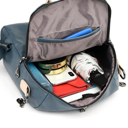 Blue women’s soft PU leather fashion backpack with adjustable straps and spacious main compartment by OBA.