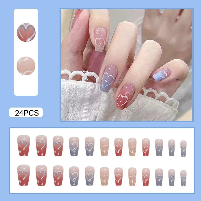 Set of 24 Y2K style press on nails by Blushimmer featuring gradient black mid-length coffin tips with moon designs and full cover false nail tips.