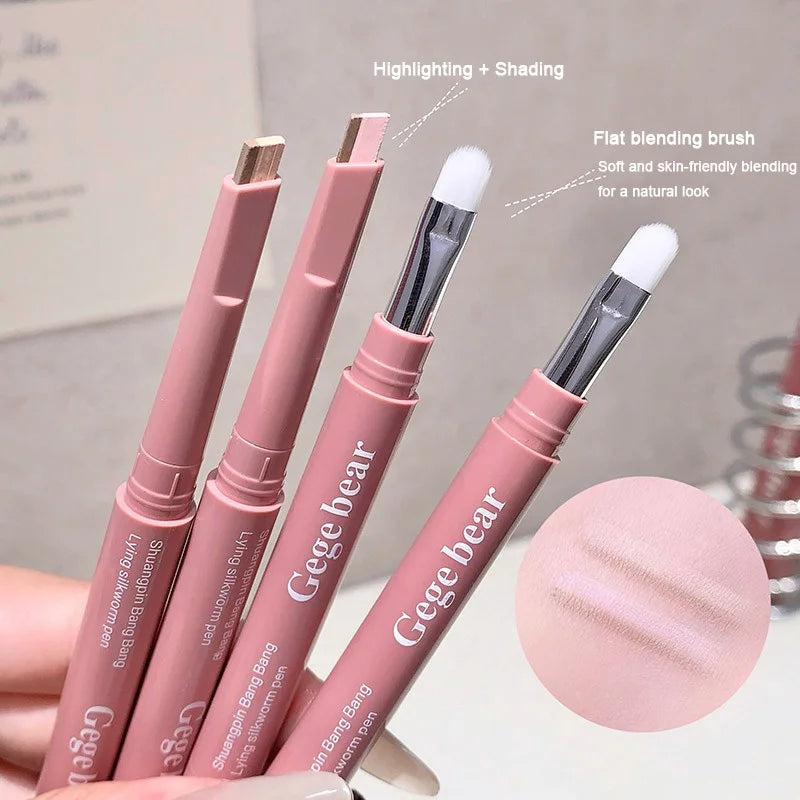 Blushimmer double-ended lying silkworm pencil with highlighter and eyeliner stick, featuring a detail brush for nude lower eyelid contour.