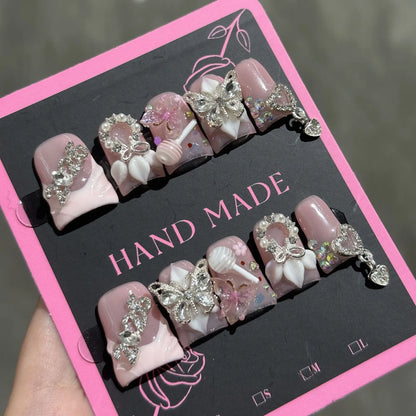 Set of 10 Ocean Style Fake Nails by Blushimmer featuring duck bill shape, 3D flowers, pearl accents, gradient blush, and French design.