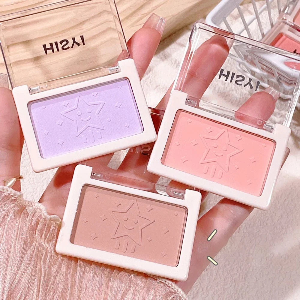 Blushimmer purple nude matte blush with brightening and natural whitening effects, highlighting cheeks in a monochrome, soft makeup look.