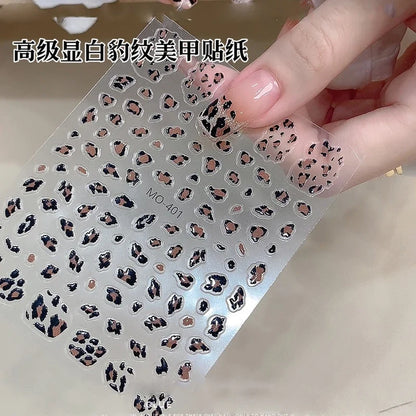 Pink leopard print nail art stickers by Blushimmer, 8x10cm, featuring pink, black, and brown leopard decal designs for DIY manicures.