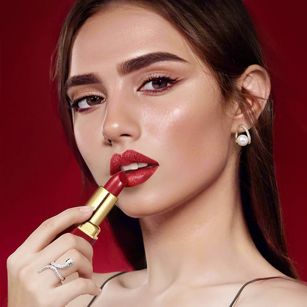 Six Blushimmer matte velvet lipsticks in gold bar tube with pearlescent glitter, ideal for Valentine's Day gift.