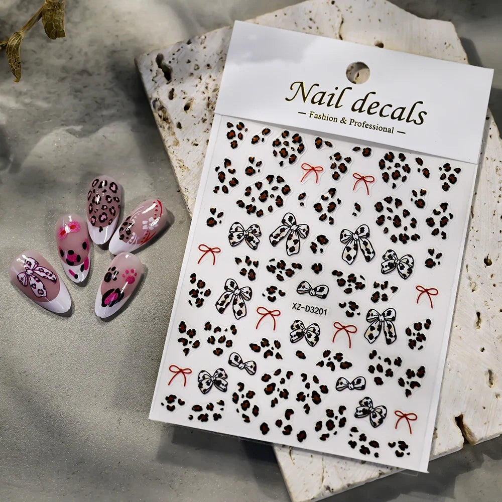 Pink leopard print nail art stickers by Blushimmer, featuring 8x10cm pink, black, and brown leopard decals for DIY manicure design.