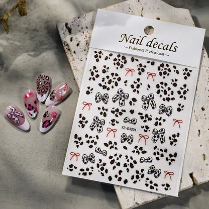 Pink leopard print nail art stickers by Blushimmer, featuring 8x10cm pink, black, and brown leopard decals for DIY manicure design.