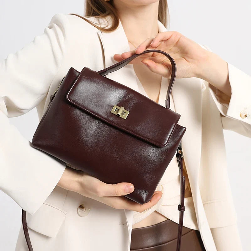 NNEOBA women's genuine leather crossbody satchel with adjustable strap and spacious interior, stylish shoulder bag for everyday use.