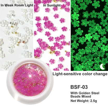 White acrylic flower nail art decorations with mixed size rhinestones, red and blue gems for manicure DIY nail design accessories.