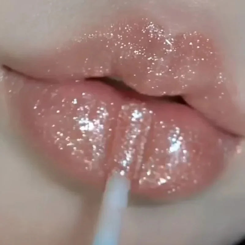 Blushimmer Sweet Sparkling Lip Glaze mirror lip shine light transparent water gloss with a glossy, shimmering finish on lips.