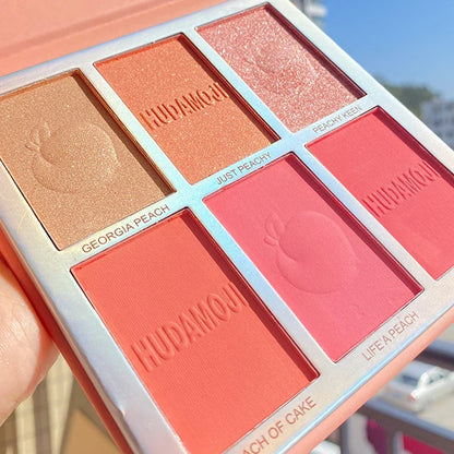 Blushimmer six-color blush and highlighter eyeshadow palette with pink shades, glitter accents, natural contour, and brightening makeup.