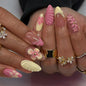 Set of 24 Blushimmer wine red almond press-on nails with cartoon rabbit, bowknot, plaid, pearl designs, and French tip accents.