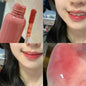 Blushimmer smoked grape purple red lip glaze reflects light, showcasing its moisturizing liquid lipstick and clear tint for Korean makeup.