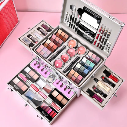 Blushimmer makeup gift set with face powder, eyeshadow palette, lipsticks, brushes, highlighter, and bronzer for women.