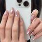 Set of 24 glossy red Cat's Eye press-on nails by Blushimmer, almond-shaped, full cover false nails with nude color finish.