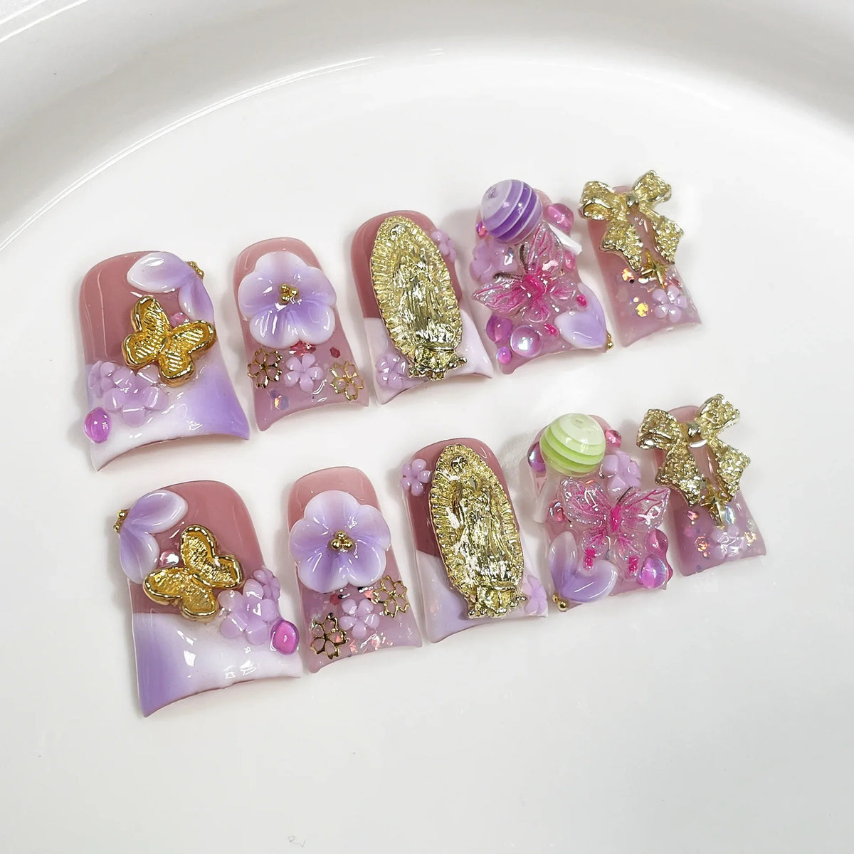 Set of 10 ocean style fake nails featuring duck bill shape, 3D flowers, pearls, gradient blush, and French nail art by Blushimmer.