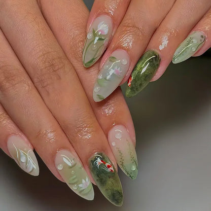 Set of 24 glossy almond false nails by Blushimmer with dark green forest mushroom pattern, gold sequins, and French style design.