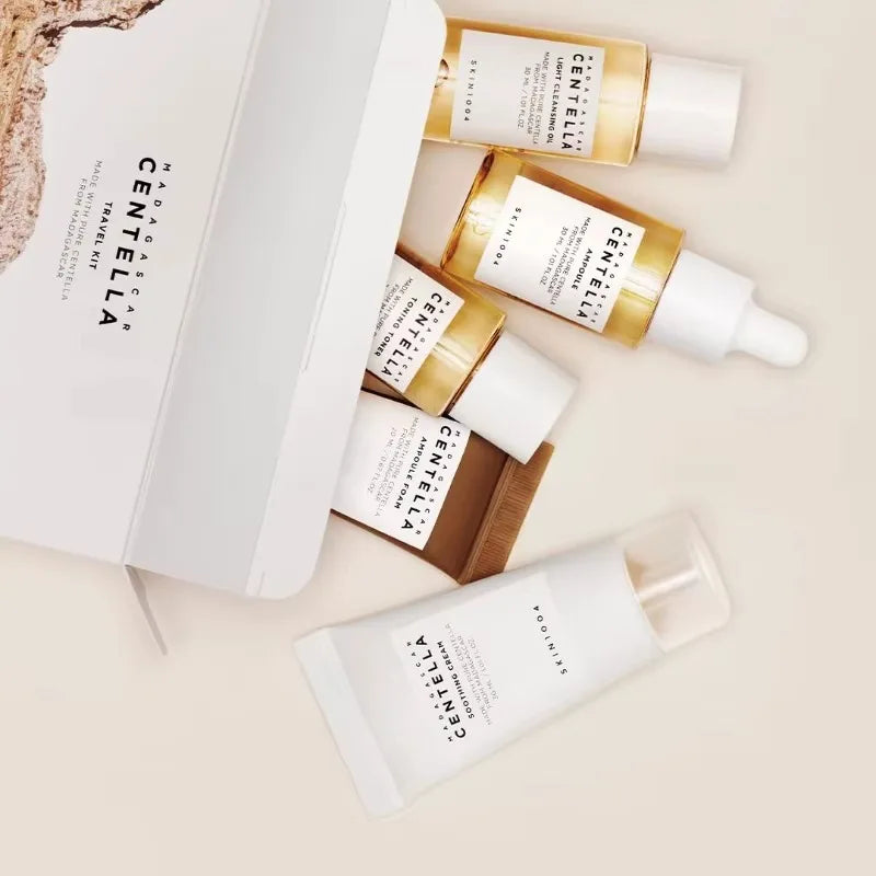 SKIN1004 Madagascar Centella travel skincare kit with toner, ampoule, soothing cream, cleansing oil, and foam in mini sizes