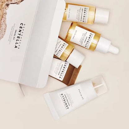 SKIN1004 Madagascar Centella travel skincare kit with toner, ampoule, soothing cream, cleansing oil, and foam in mini sizes