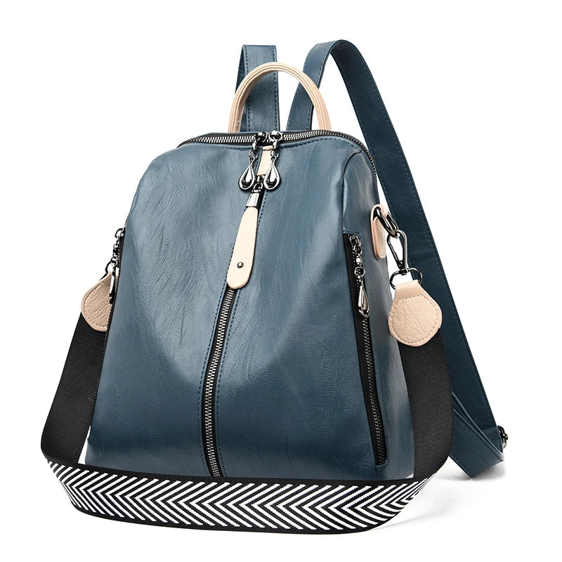 Blue women’s soft PU leather fashion backpack by OBA, showing a sleek, stylish backpack with adjustable straps and a front pocket.