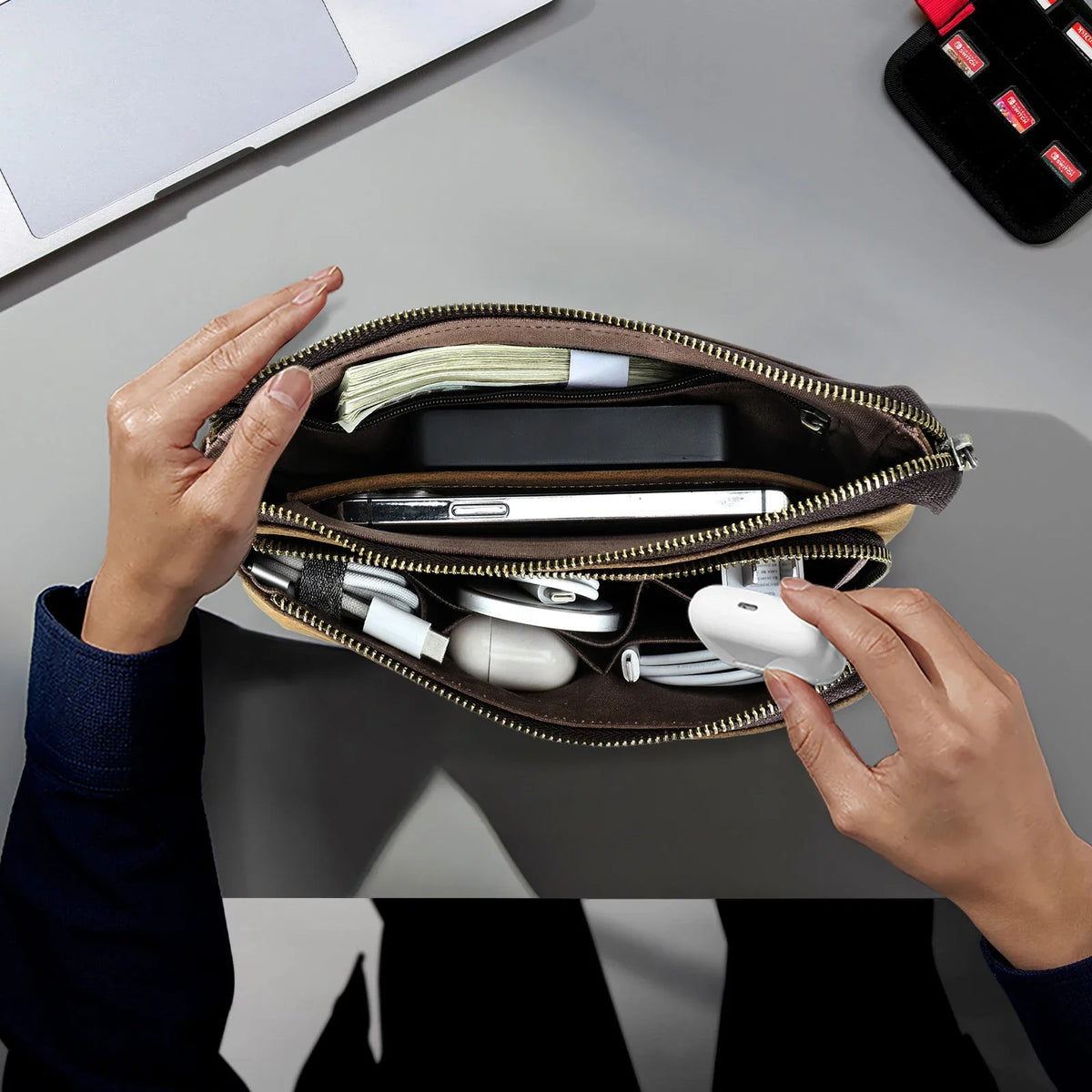 Genuine leather men's clutch bag and long wallet by NNEOBA, featuring a sleek design and ample storage, on a neutral background.