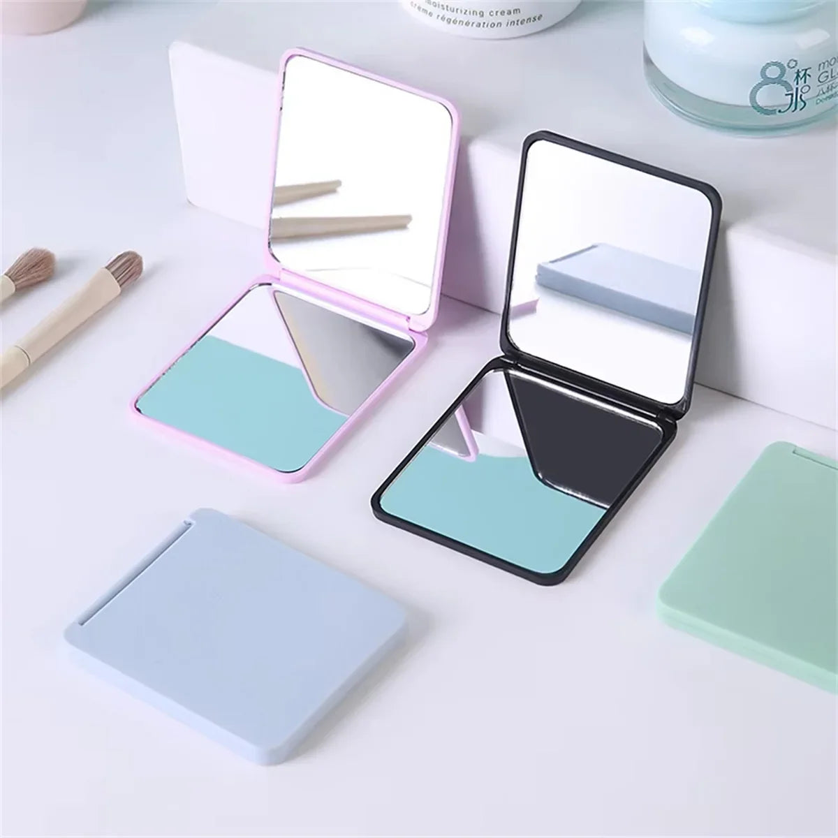 Blushimmer foldable double-sided portable makeup mirror with compact design for dorms and gifting, shown in a small, sleek form.
