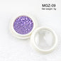 White acrylic flower nail art decorations with mixed size rhinestones and colorful gems for DIY manicure designs.