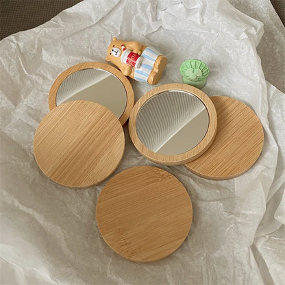 Blushimmer portable round wooden cosmetic mirror, compact travel-friendly beauty tool for on-the-go makeup and grooming.