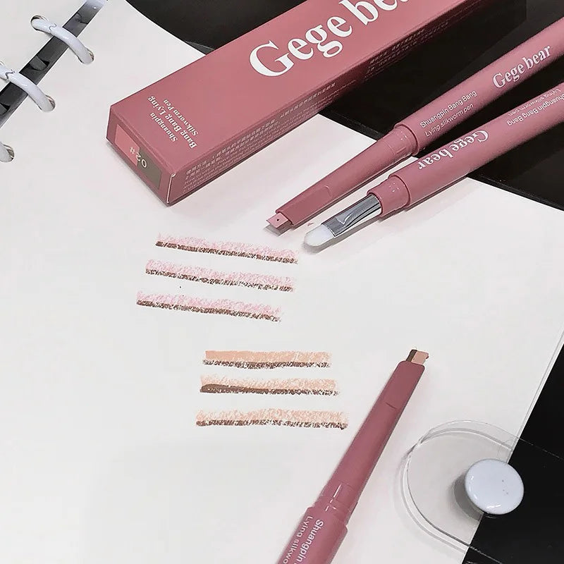 Blushimmer double-ended lying silkworm pencil with highlighter and eyeliner, nude shade, featuring a detail brush for eyelid contouring.