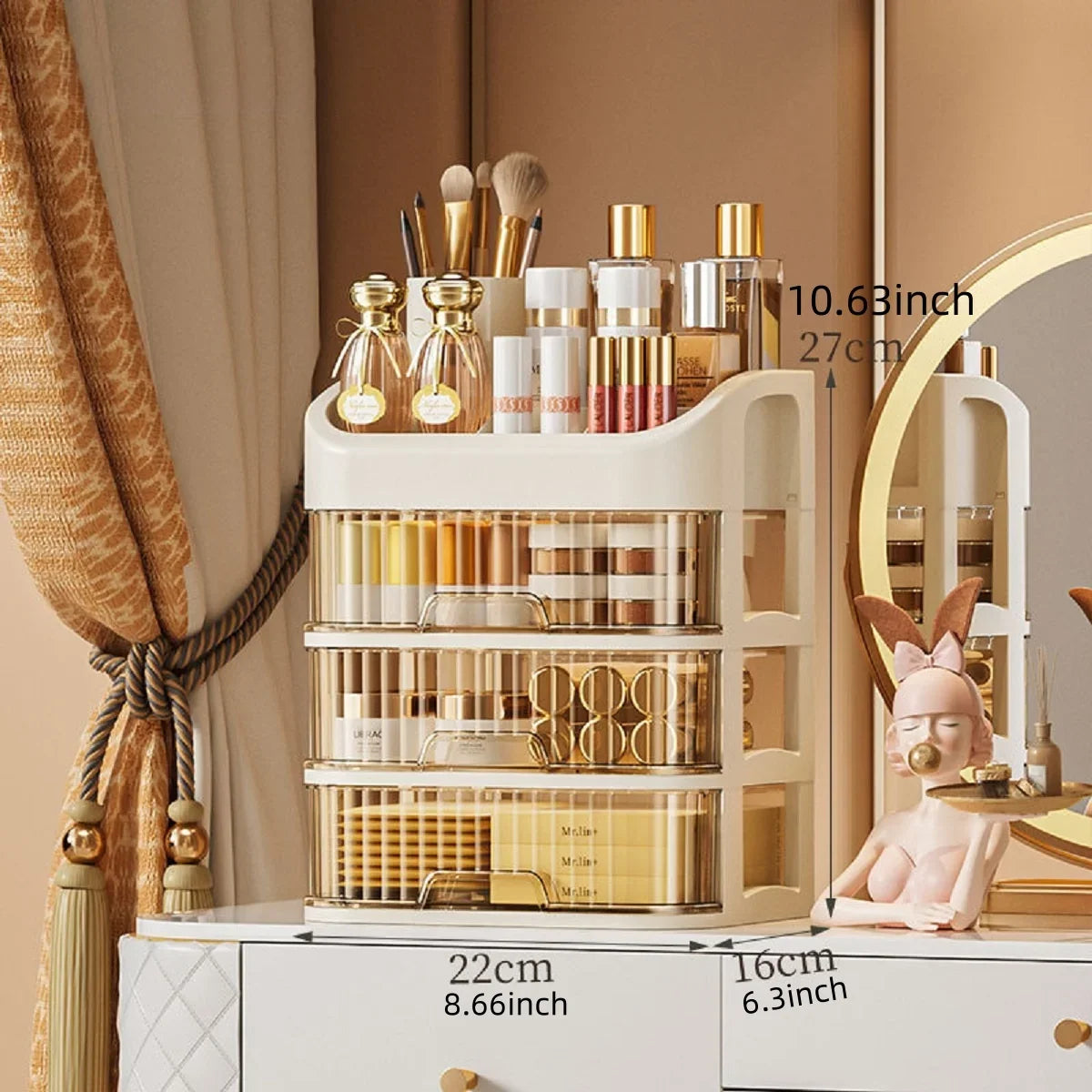 Blushimmer multi-layer makeup storage box with compartments for skincare, eyeshadow, lipsticks, and lotions on a dresser or bathroom counter.