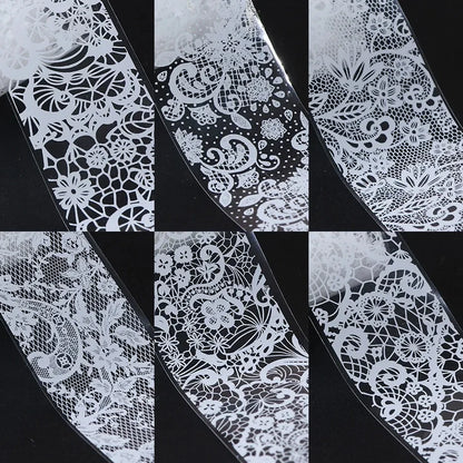 Box of 10 rolls of white and black lace nail art foil transfer stickers for DIY manicure nail decoration by Blushimmer