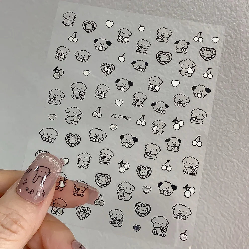 Set of 12 colorful cartoon dog and cat nail art stickers with 3D graffiti designs on self-adhesive 8x10cm sheets.