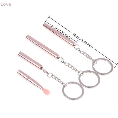 Blushimmer multifunctional silicone lipstick and eyeshadow brush with cover, portable keychain dustproof tool in black.