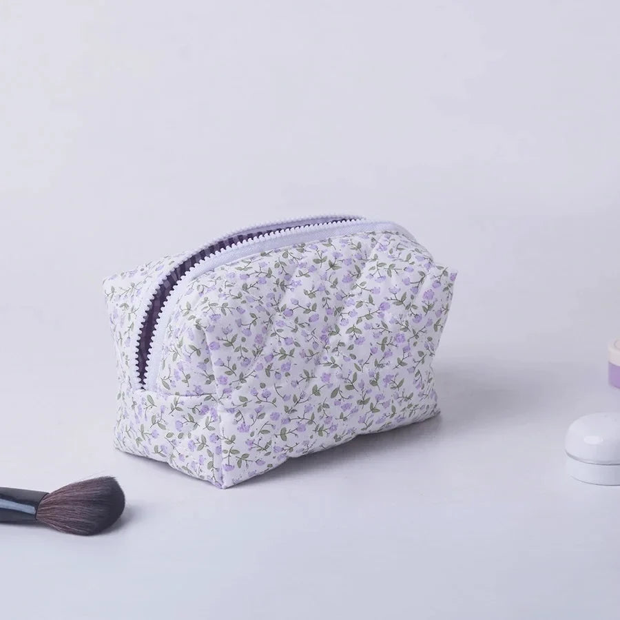Blushimmer floral quilted makeup bag with puffy design, large travel cosmetic pouch with flower print and multiple compartments.