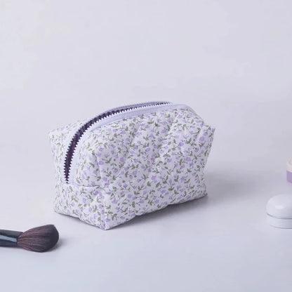 Blushimmer floral quilted makeup bag with puffy design, large travel cosmetic pouch with flower print and multiple compartments.