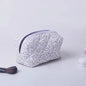 Blushimmer floral quilted makeup bag with puffy design, large travel cosmetic pouch with flower print and multiple compartments.