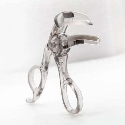 Blushimmer frameless eyelash curler with wide-angle design and toothed comb for professional, lasting curl on eyelashes.