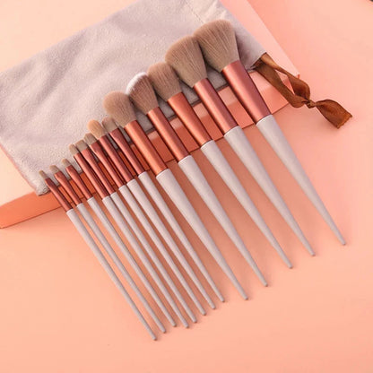 Set of 13 Blushimmer makeup brushes including eye shadow, foundation, blush, and cosmetic tools in a soft makeup bag.