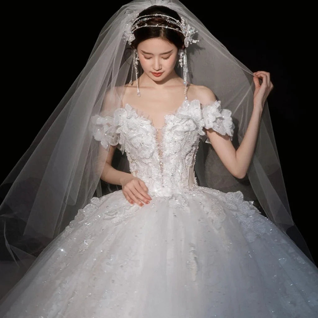 Luxurious wedding gown by EdleessFashion with shiny applique and sweetheart neckline, detailed close-up of elegant dress fabric