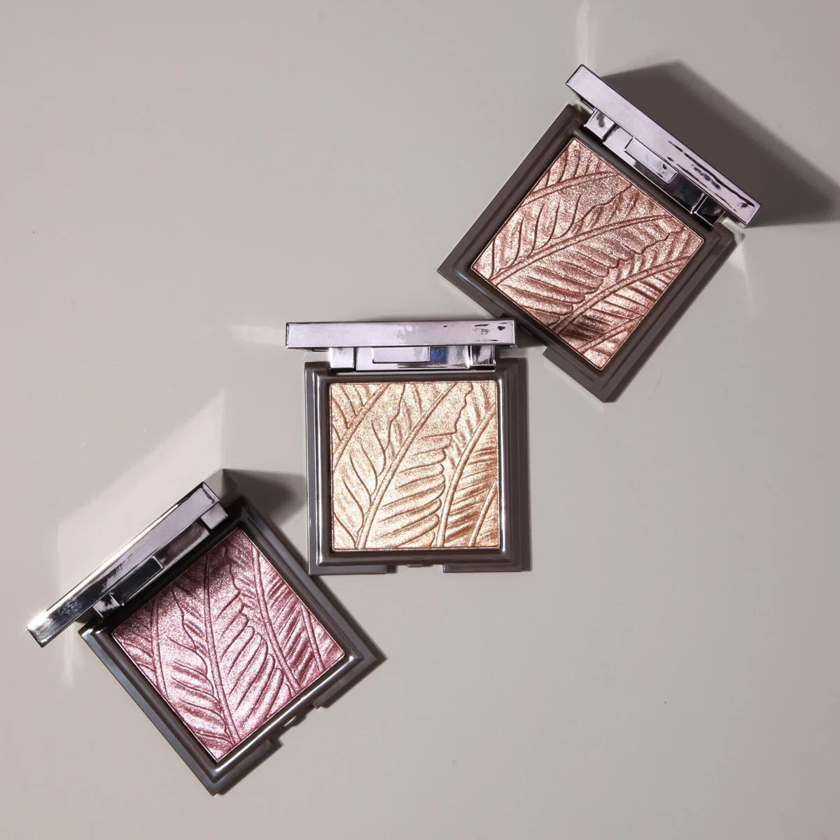 Blushimmer embossed bronzer and highlighter makeup palette with matte contour shades and pressed powders for facial contouring.