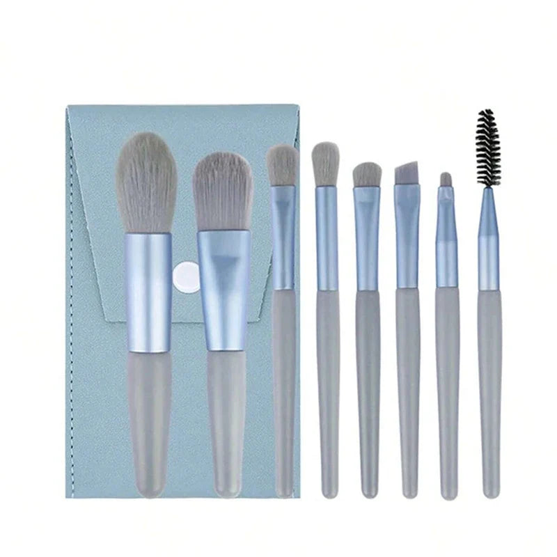 Set of 13 Blushimmer makeup brushes including eyeshadow, foundation, and blush brushes in a soft makeup tools bag.