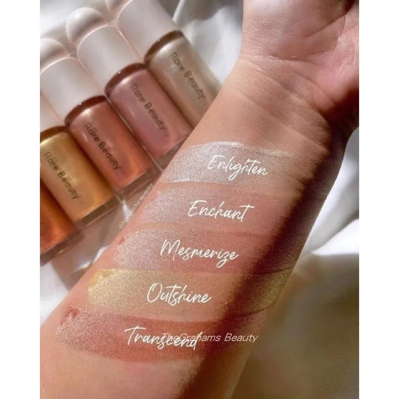 Blushimmer Rare Beauty Positive Light Liquid Contour, blush, and highlighter in a sleek makeup bottle with a shiny finish.