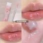 Blushimmer Lip Oil Uuny transparent water gloss on lips, featuring a shiny, moisturizing lip glaze with a mirror-like finish.